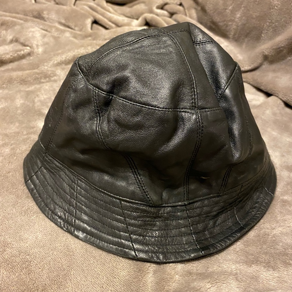 Women’s reversible hat; leather and velvety type corduroy.